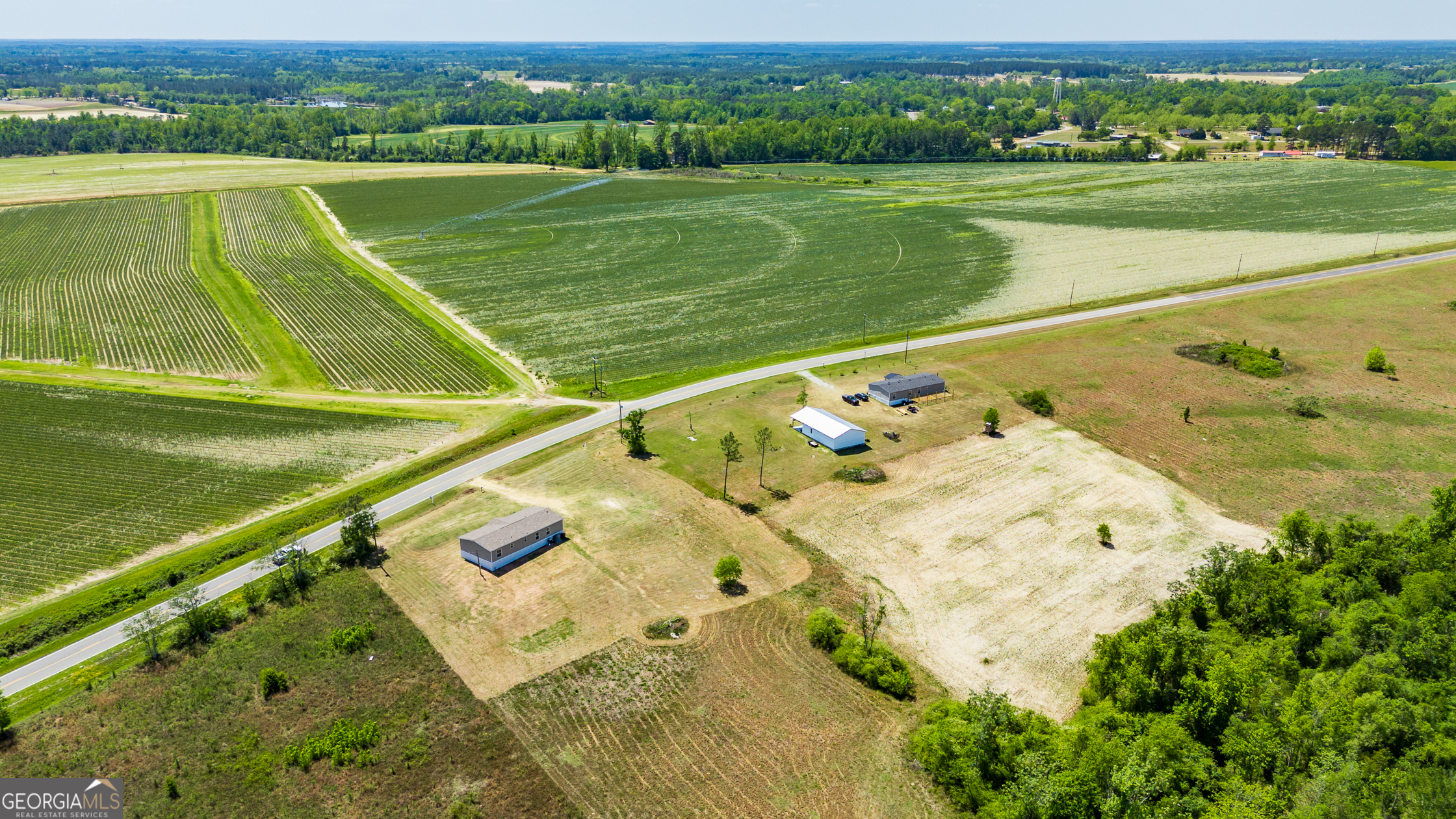 559 Evergreen Church Road Cobbtown, GA 30420 - Photo 39 of 40 a view of a field with a lake