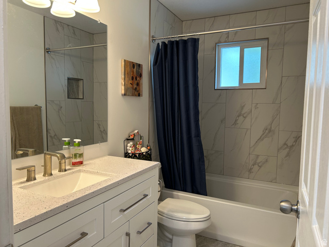 7659 State Street Midvale, UT 84047 - Photo 13 of 33 Full bath featuring vanity and shower / tub combo with curtain