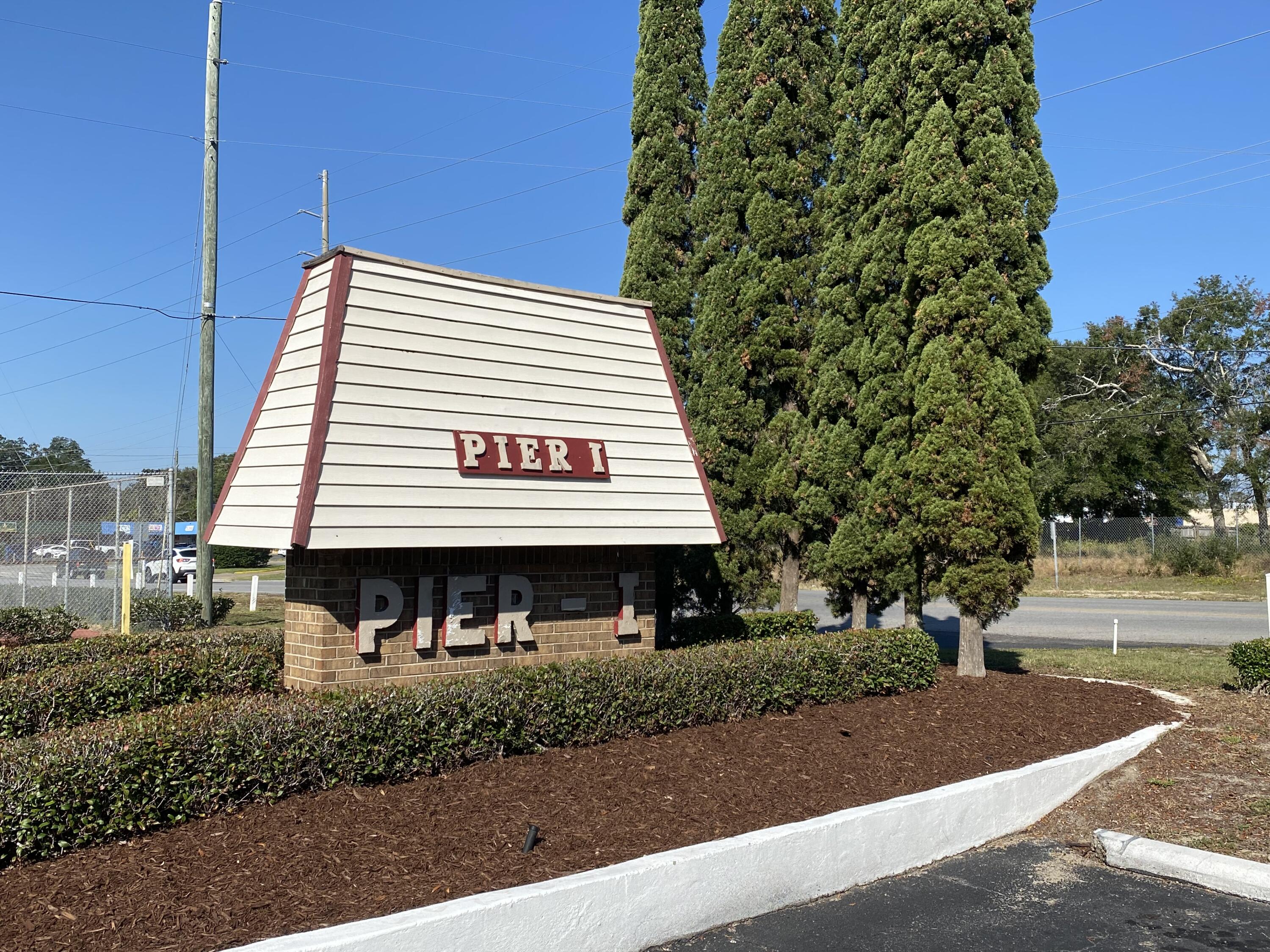a view of a cafe with a tree