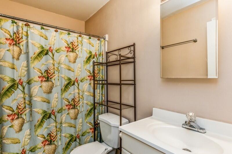 210 Pelham Road, Unit 201A Fort Walton Beach, FL 32547 - Photo 27 of 38 a bathroom with a sink toilet and shower