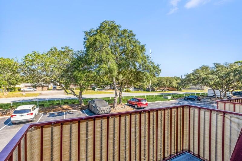 210 Pelham Road, Unit 201A Fort Walton Beach, FL 32547 - Photo 28 of 38 a view of a balcony with wooden fence