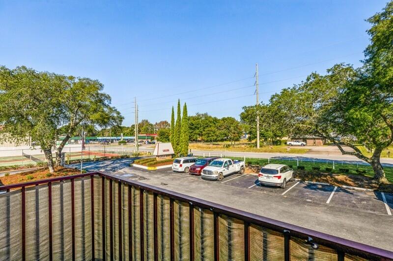 210 Pelham Road, Unit 201A Fort Walton Beach, FL 32547 - Photo 29 of 38 a view of swimming pool with outdoor seating and city view