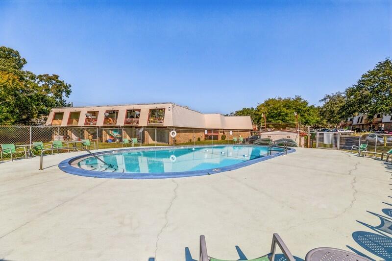 210 Pelham Road, Unit 201A Fort Walton Beach, FL 32547 - Photo 34 of 38 a view of a swimming pool with a patio