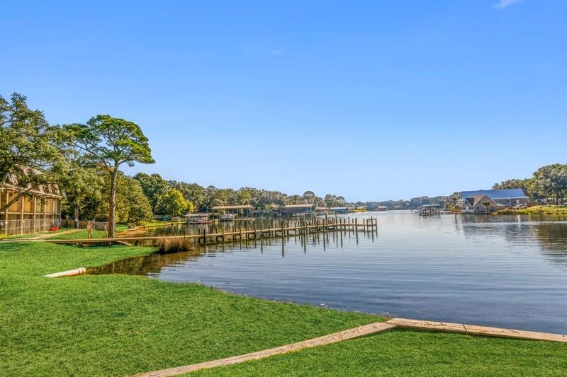 210 Pelham Road, Unit 201A Fort Walton Beach, FL 32547 - Photo 35 of 38 a view of a lake with houses