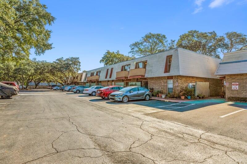 210 Pelham Road, Unit 201A Fort Walton Beach, FL 32547 - Photo 7 of 38 a view of a car is parked in front of a house