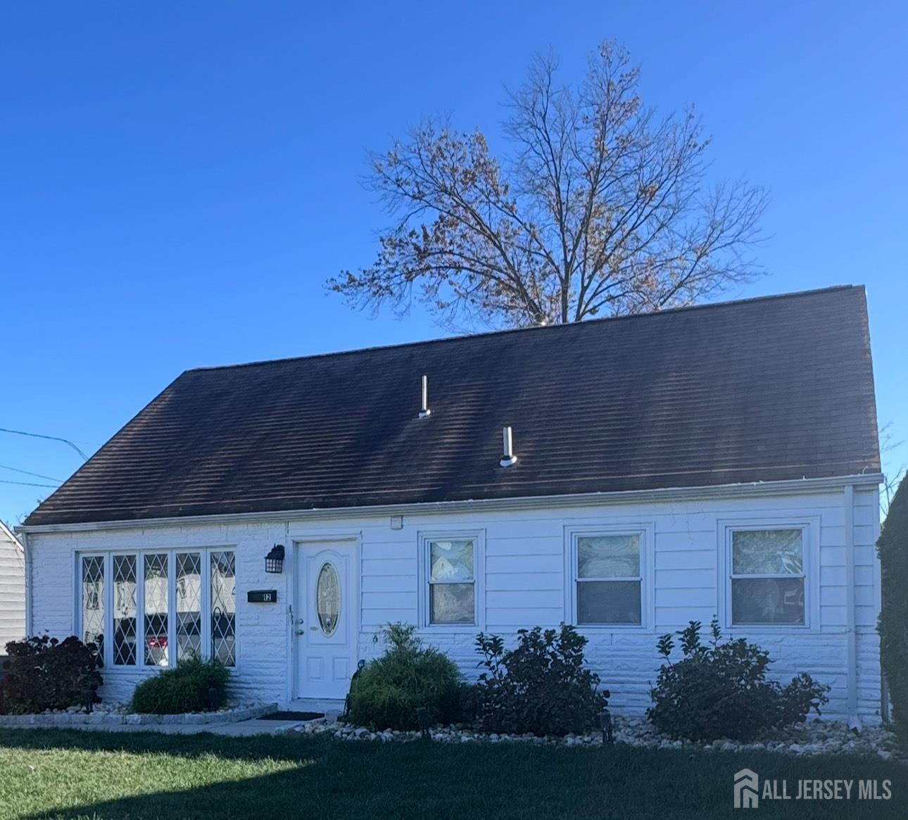 a view of house with yard