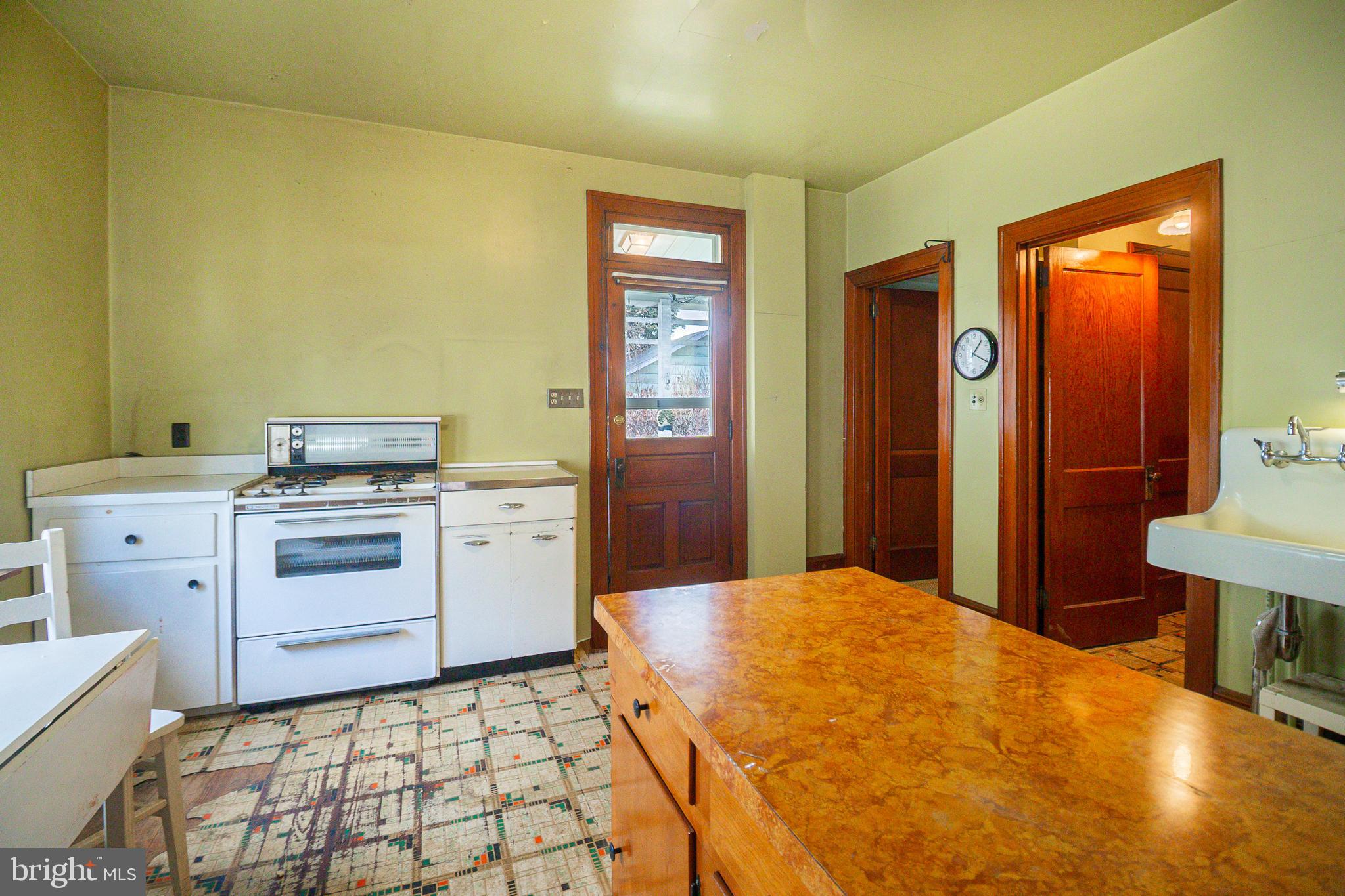 232 Henderson Street Carlisle, PA 17013 - Photo 15 of 28 a kitchen with a stove and a cabinets