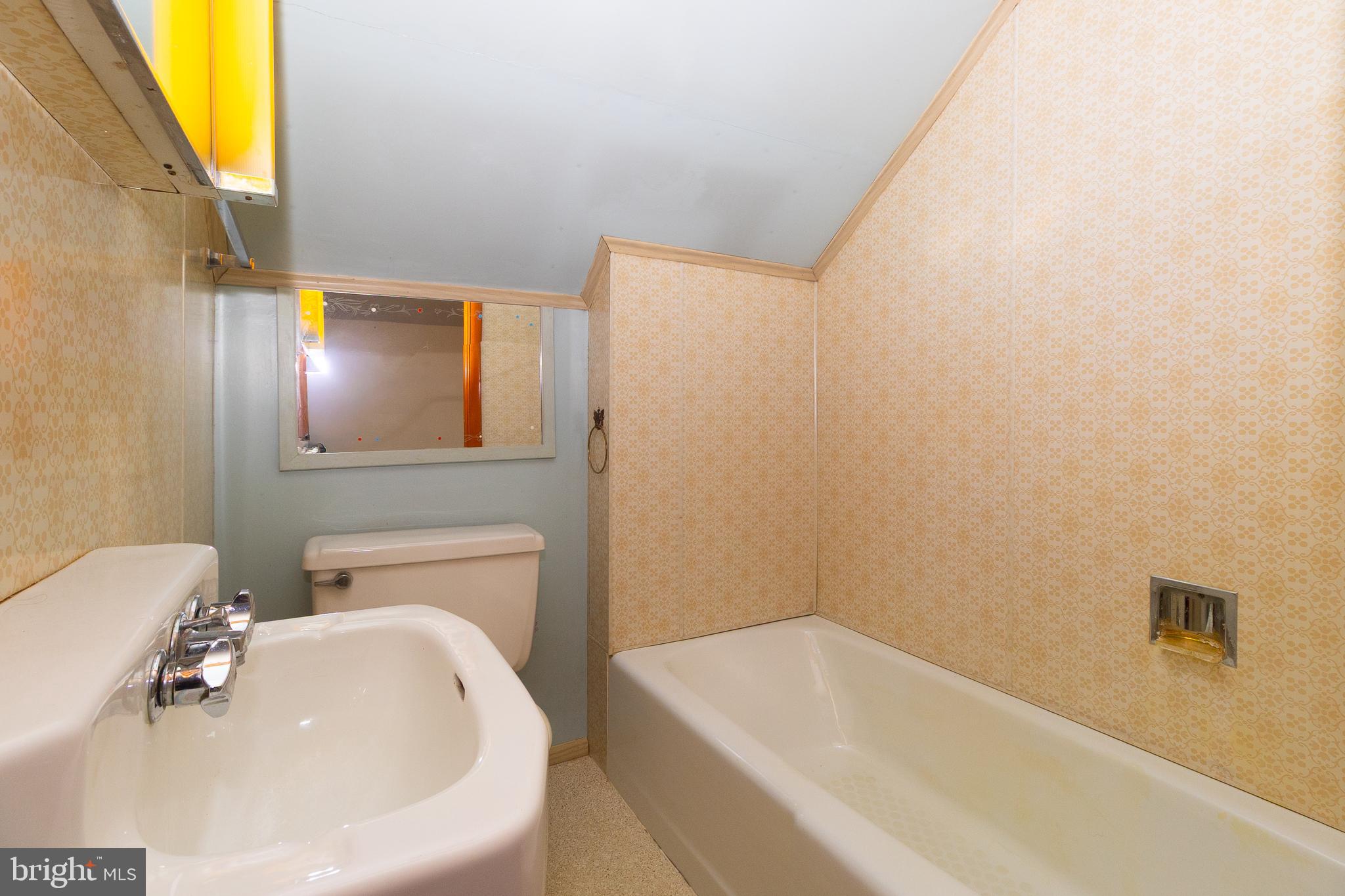 232 Henderson Street Carlisle, PA 17013 - Photo 20 of 28 a white bath tub sitting next to a white sink