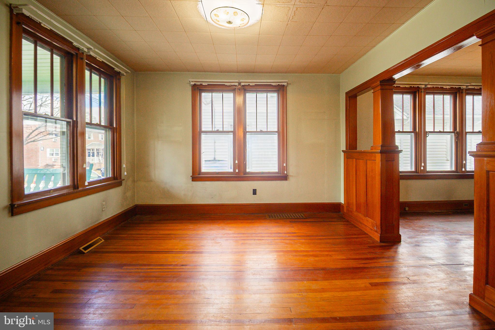 232 Henderson Street Carlisle, PA 17013 - Photo 7 of 28 a view of an empty room with wooden floor and a window
