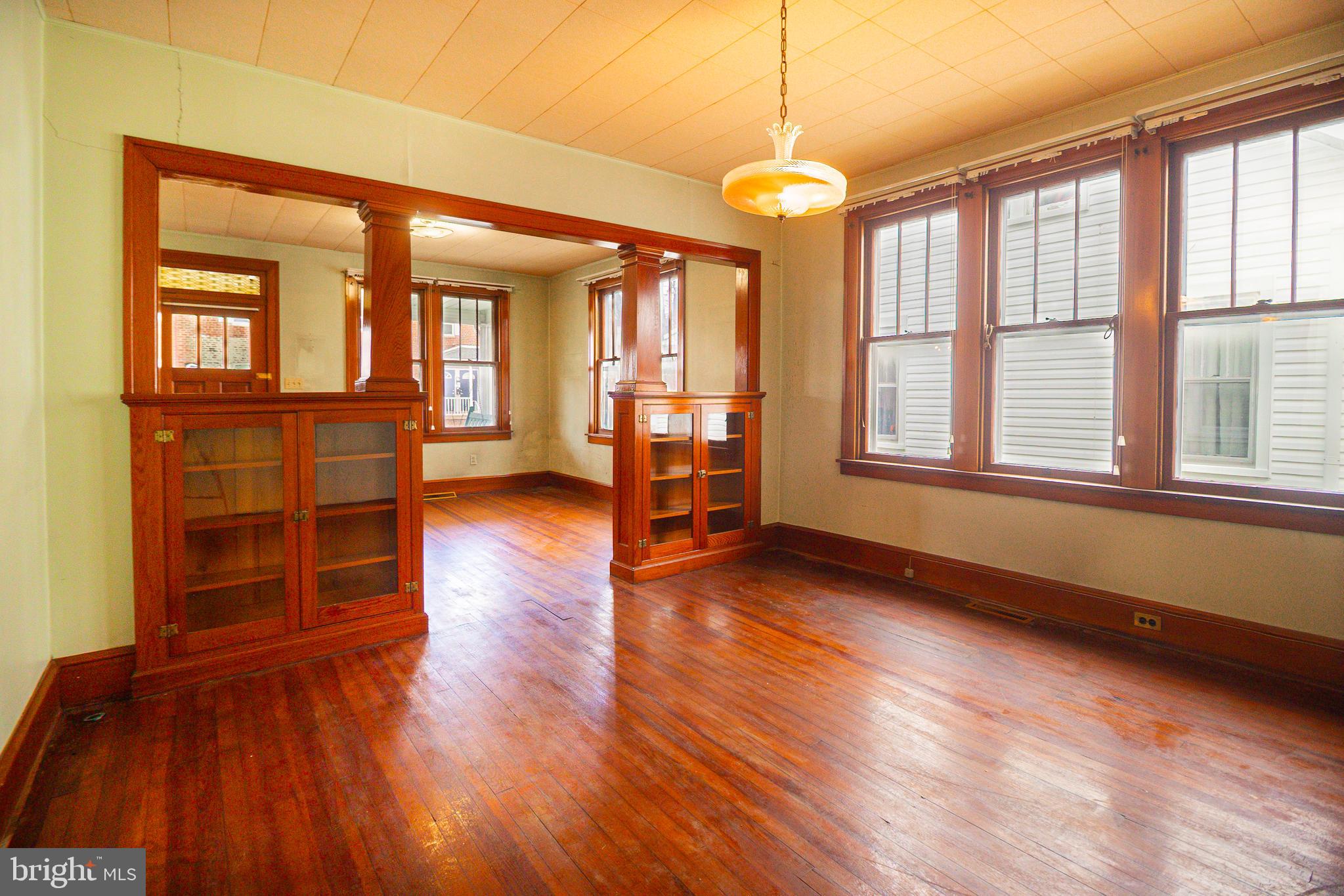 232 Henderson Street Carlisle, PA 17013 - Photo 10 of 28 an empty room with wooden floor and windows