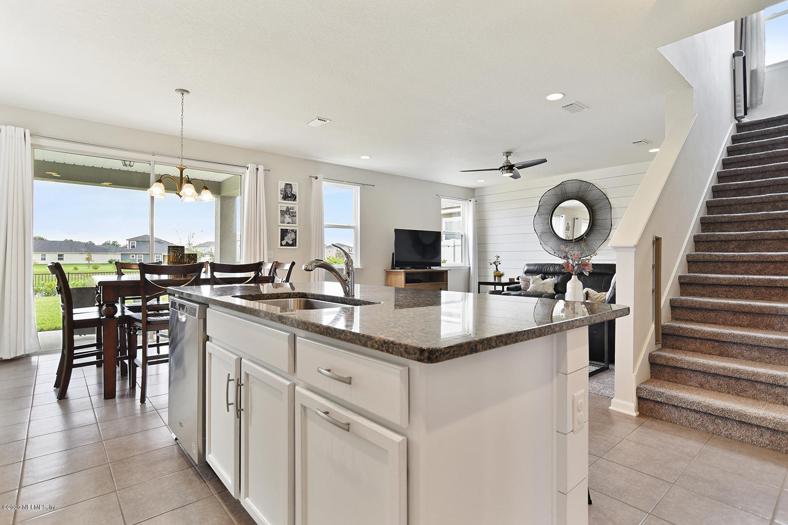 14780 Trellis Street Jacksonville, FL 32258 - Photo 14 of 29 a kitchen with cabinets and chairs
