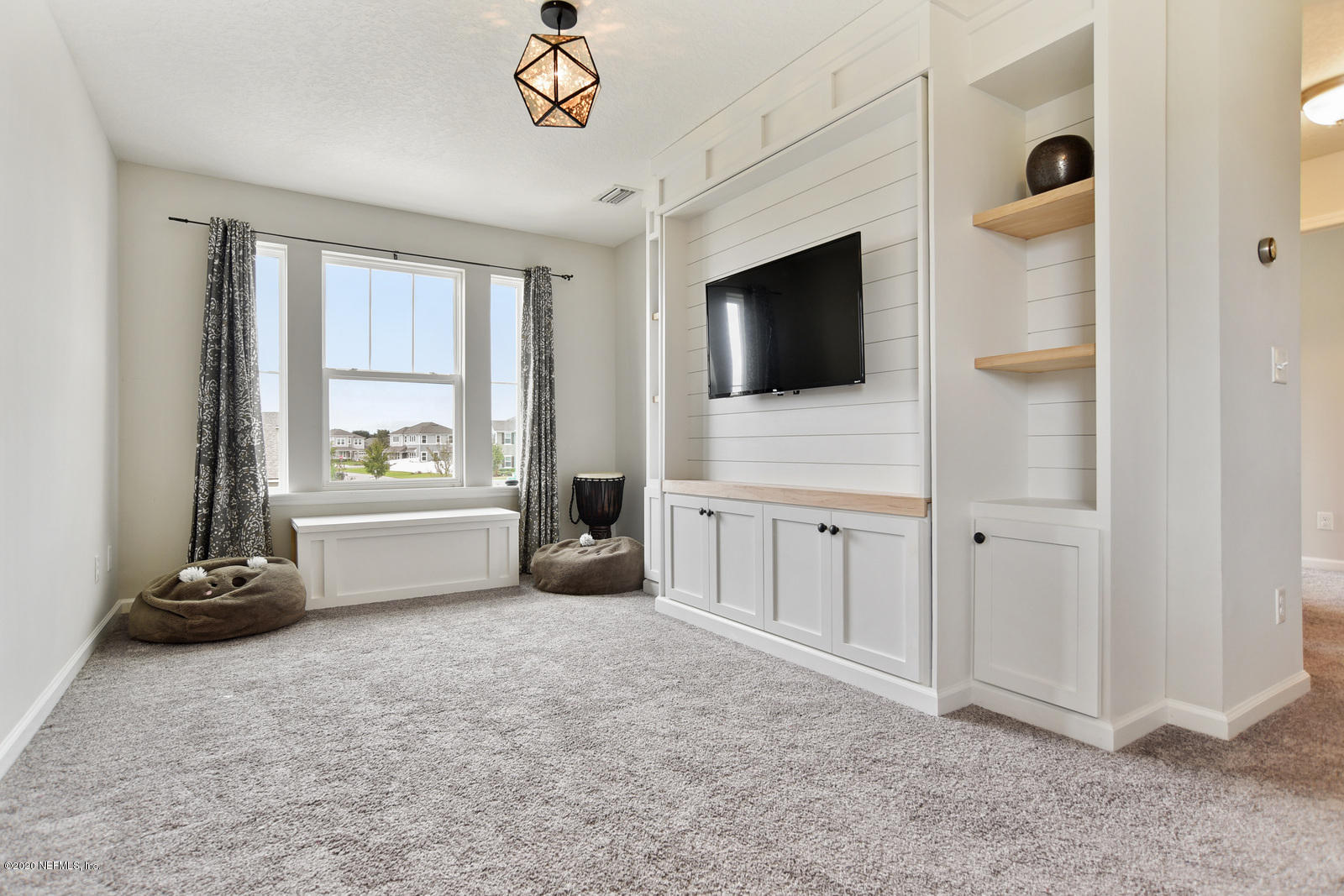 14780 Trellis Street Jacksonville, FL 32258 - Photo 15 of 29 a view of livingroom with furniture flat screen tv and windows