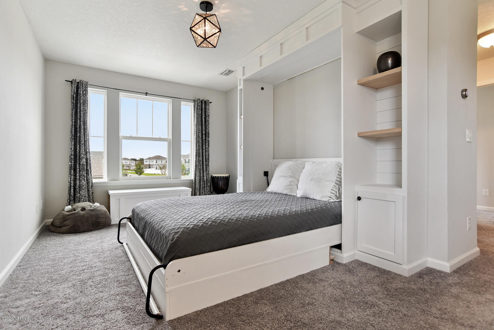 14780 Trellis Street Jacksonville, FL 32258 - Photo 16 of 29 a spacious bedroom with a bed and a window