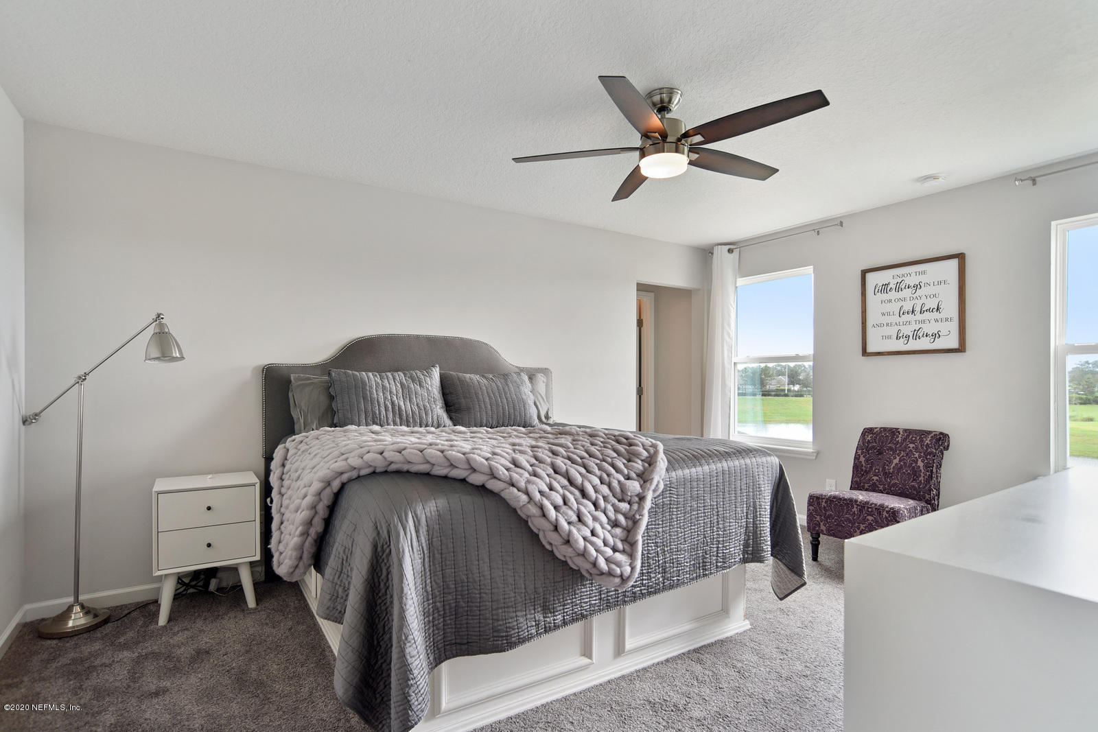 14780 Trellis Street Jacksonville, FL 32258 - Photo 18 of 29 a bedroom with a bed and a chandelier