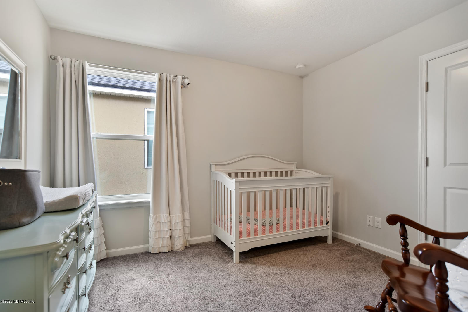 14780 Trellis Street Jacksonville, FL 32258 - Photo 21 of 29 a room with a baby crib and a window