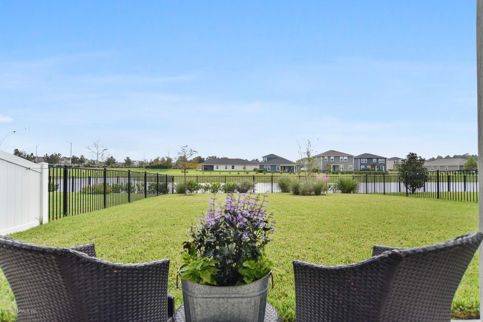 14780 Trellis Street Jacksonville, FL 32258 - Photo 25 of 29 a view of a lake with a yard and large trees