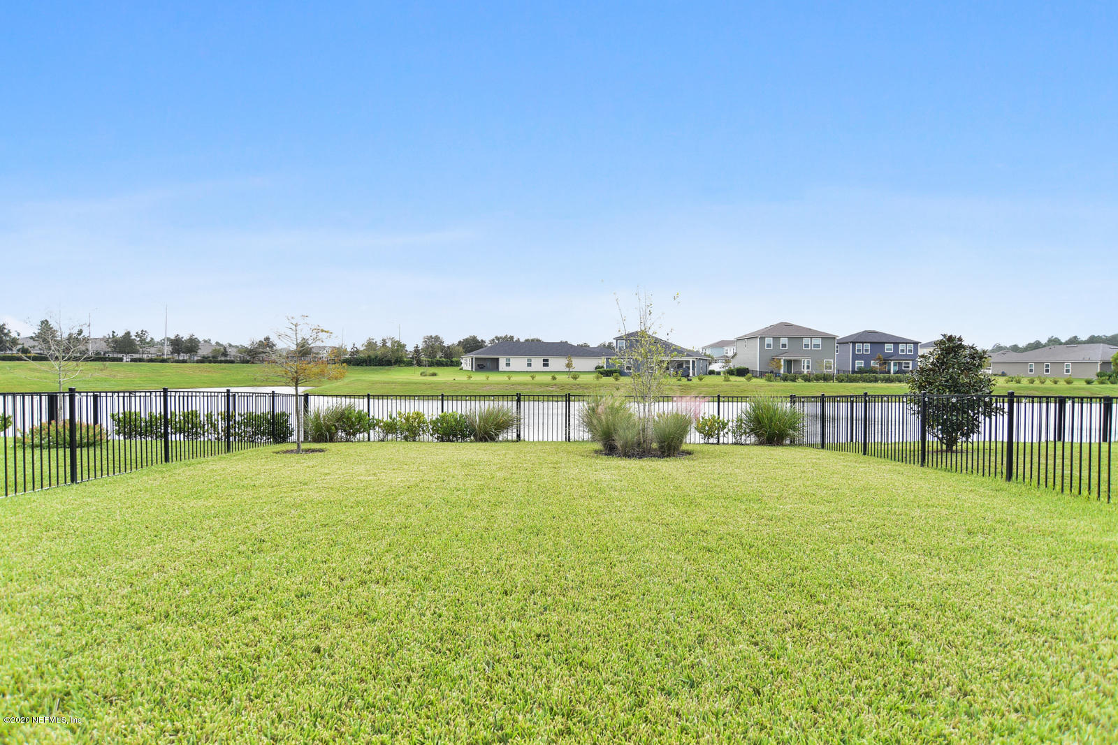 14780 Trellis Street Jacksonville, FL 32258 - Photo 27 of 29 a view of a lake with houses in the background
