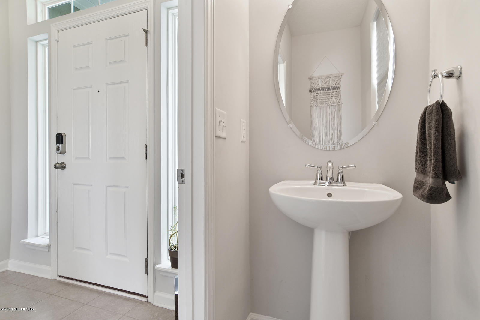 14780 Trellis Street Jacksonville, FL 32258 - Photo 5 of 29 a bathroom with a sink a mirror and shower