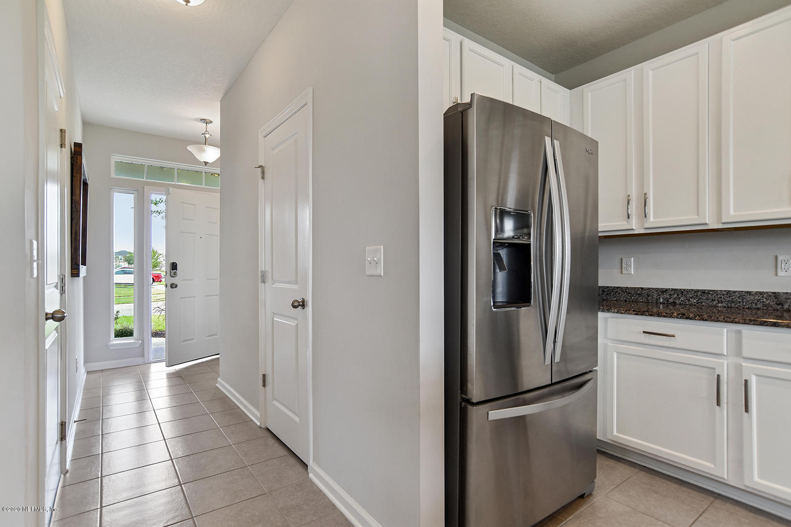 14780 Trellis Street Jacksonville, FL 32258 - Photo 7 of 29 a kitchen with stainless steel appliances granite countertop a refrigerator and a stove top oven