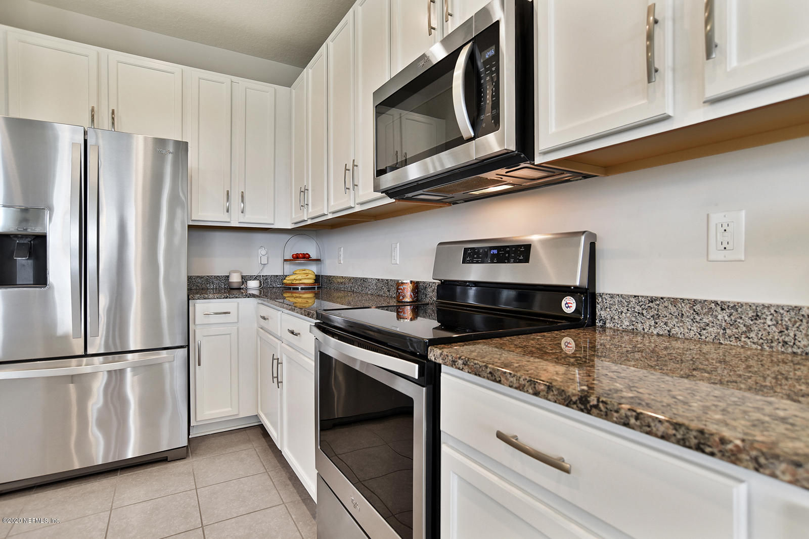 14780 Trellis Street Jacksonville, FL 32258 - Photo 8 of 29 a kitchen with appliances cabinets and a counter top space