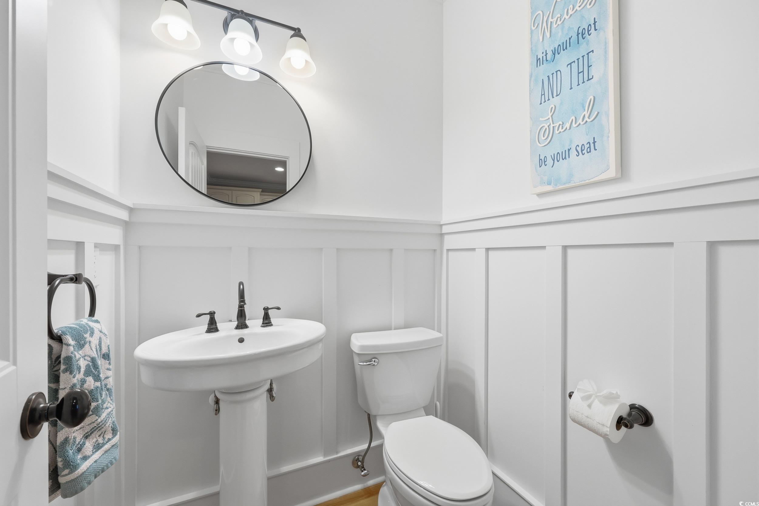 43 Sandlapper Way Pawleys Island, SC 29585 - Photo 11 of 33 Half bath with a wainscoted wall and a decorative wall