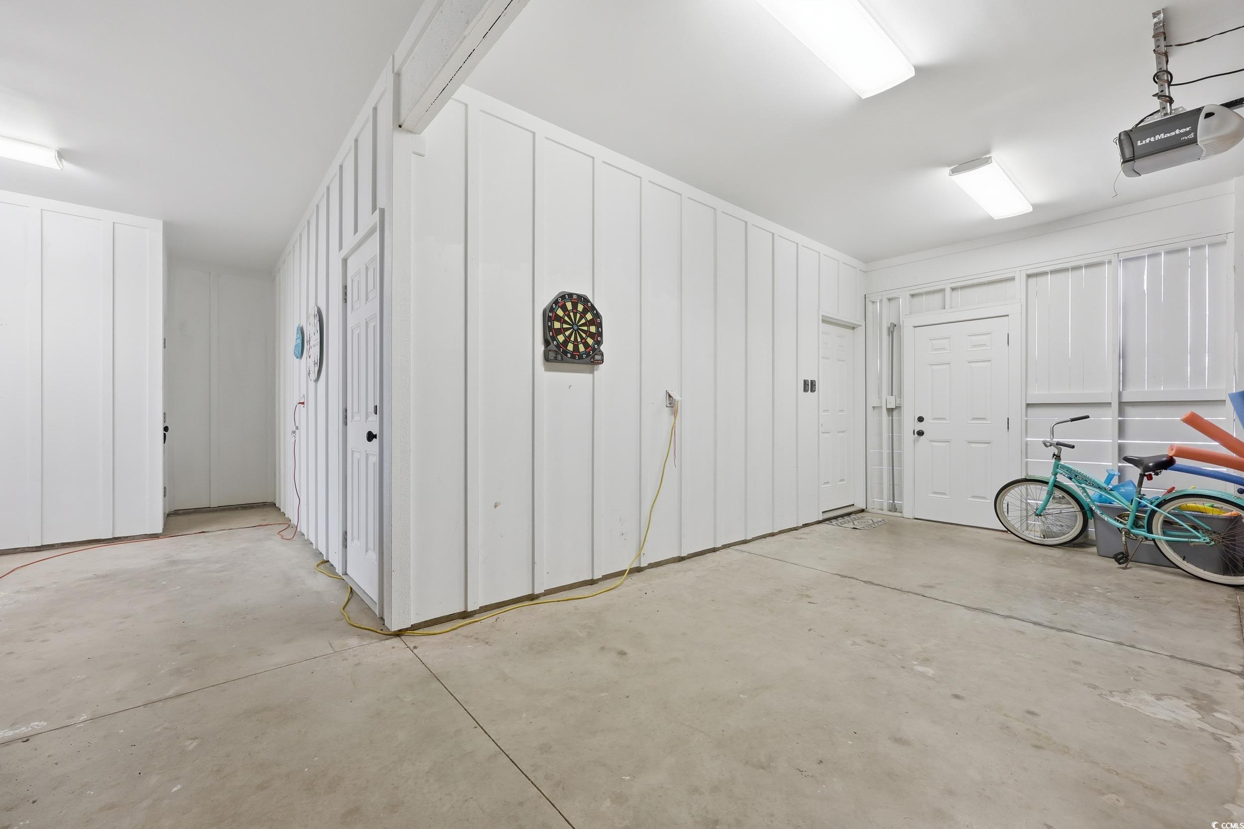 43 Sandlapper Way Pawleys Island, SC 29585 - Photo 23 of 33 Garage featuring a garage door opener
