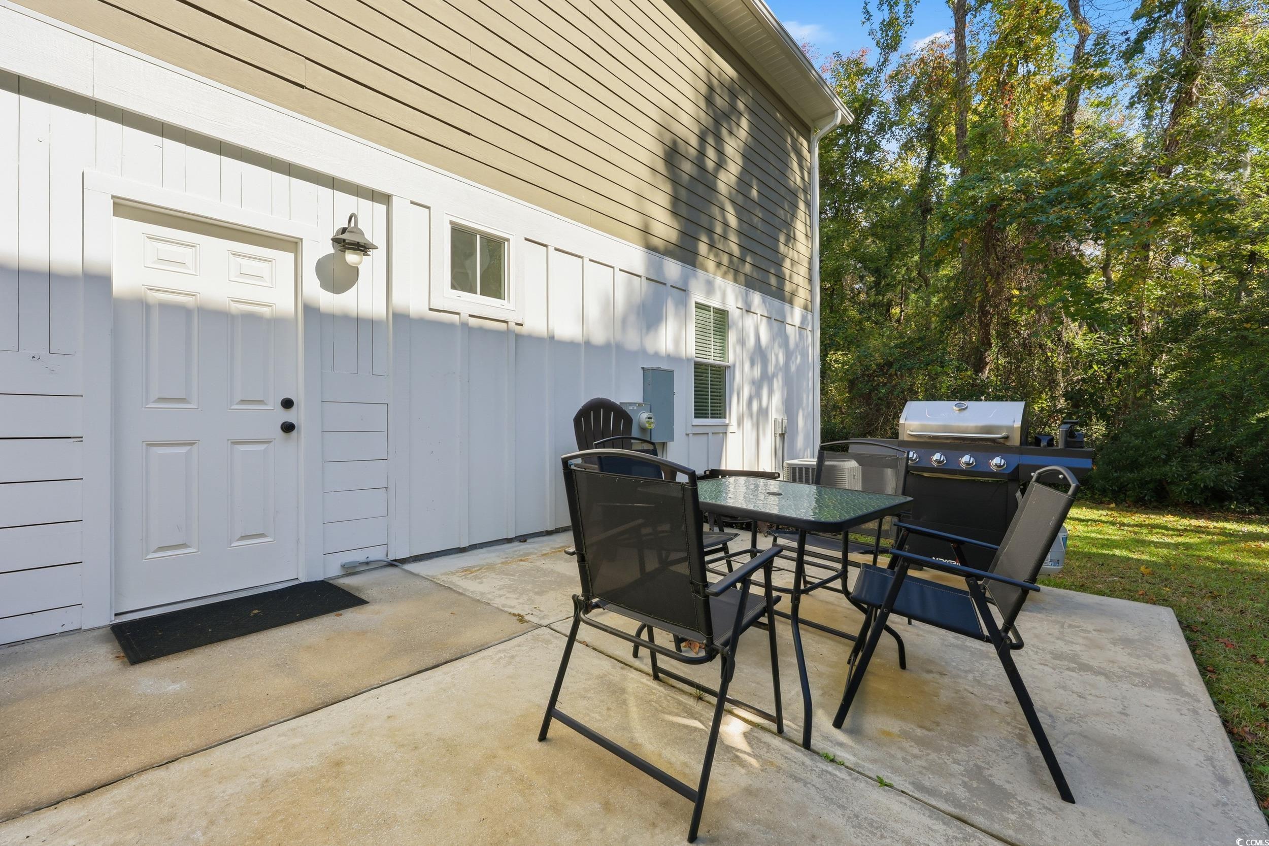 43 Sandlapper Way Pawleys Island, SC 29585 - Photo 24 of 33 View of patio featuring outdoor dining space
