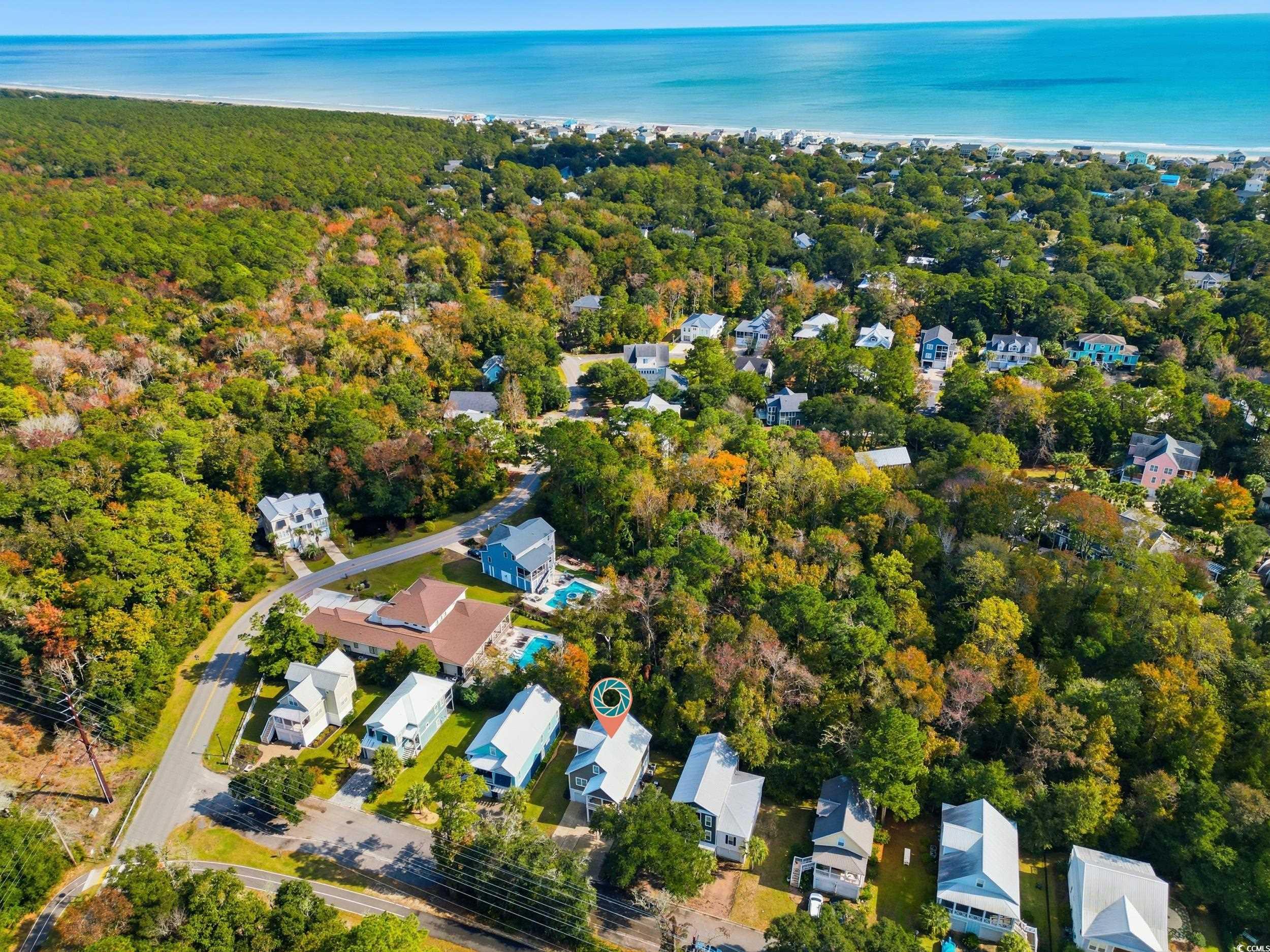 43 Sandlapper Way Pawleys Island, SC 29585 - Photo 31 of 33 Aerial view of property's location with nearby suburban area and a large body of water