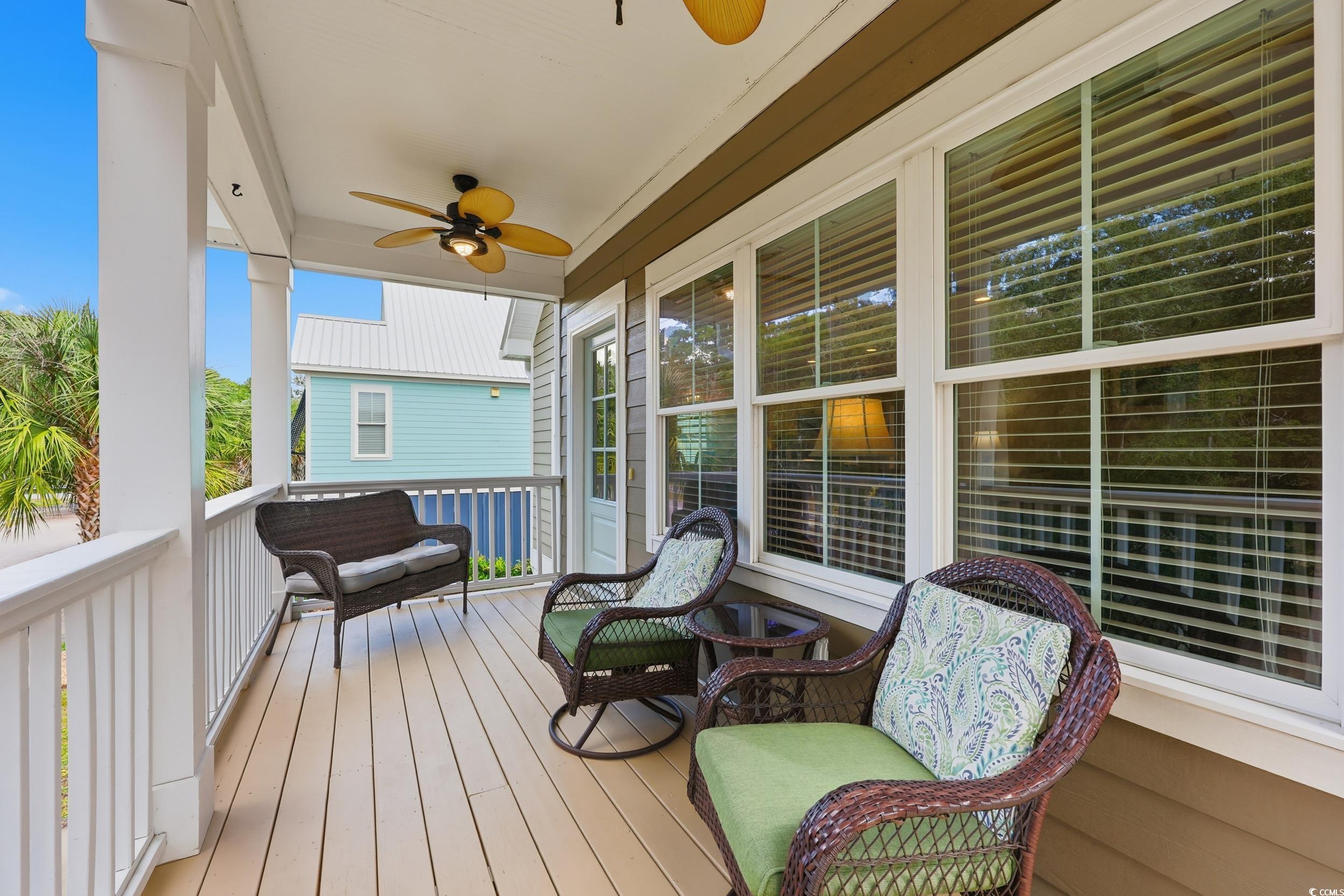43 Sandlapper Way Pawleys Island, SC 29585 - Photo 4 of 33 Wooden deck with a ceiling fan