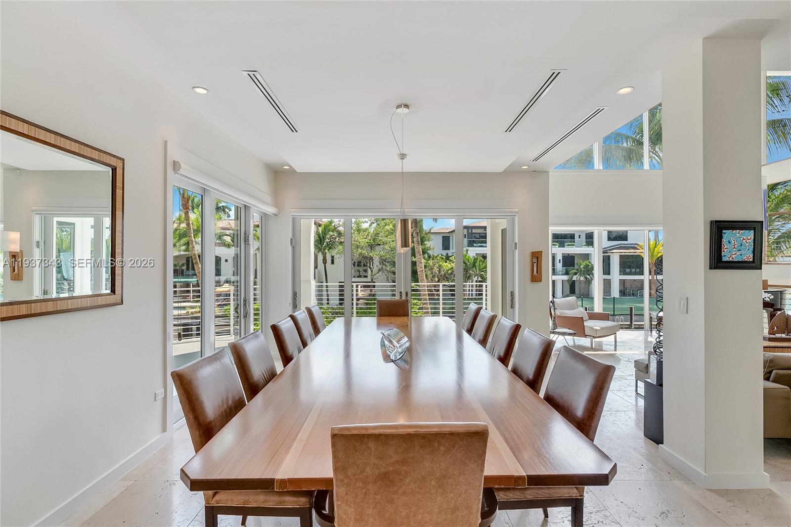 3835 Carole Court Miami, FL 33133 - Photo 12 of 41 a view of a dining room with furniture window and outside view