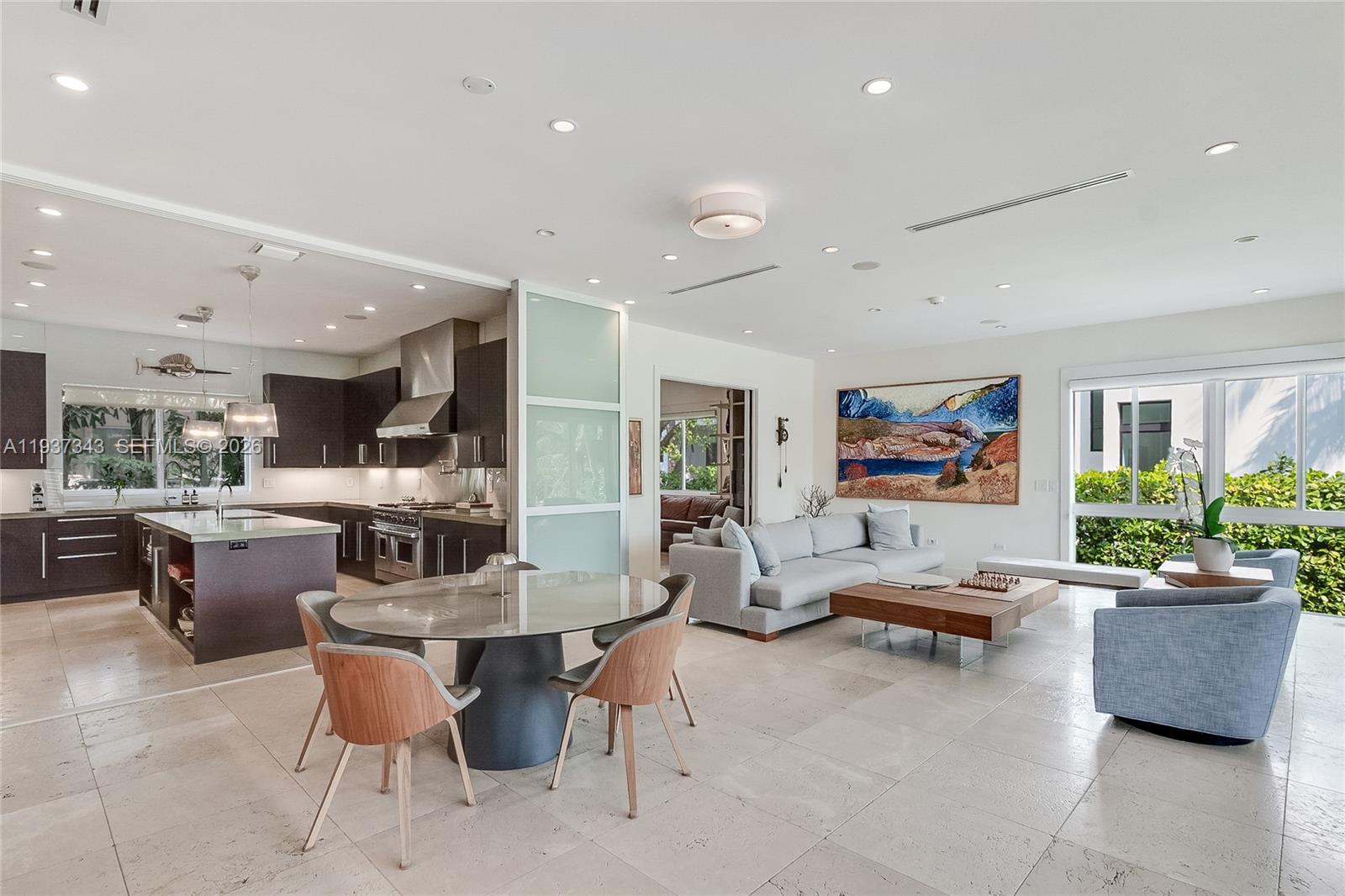 3835 Carole Court Miami, FL 33133 - Photo 14 of 41 a living room with furniture and a potted plant