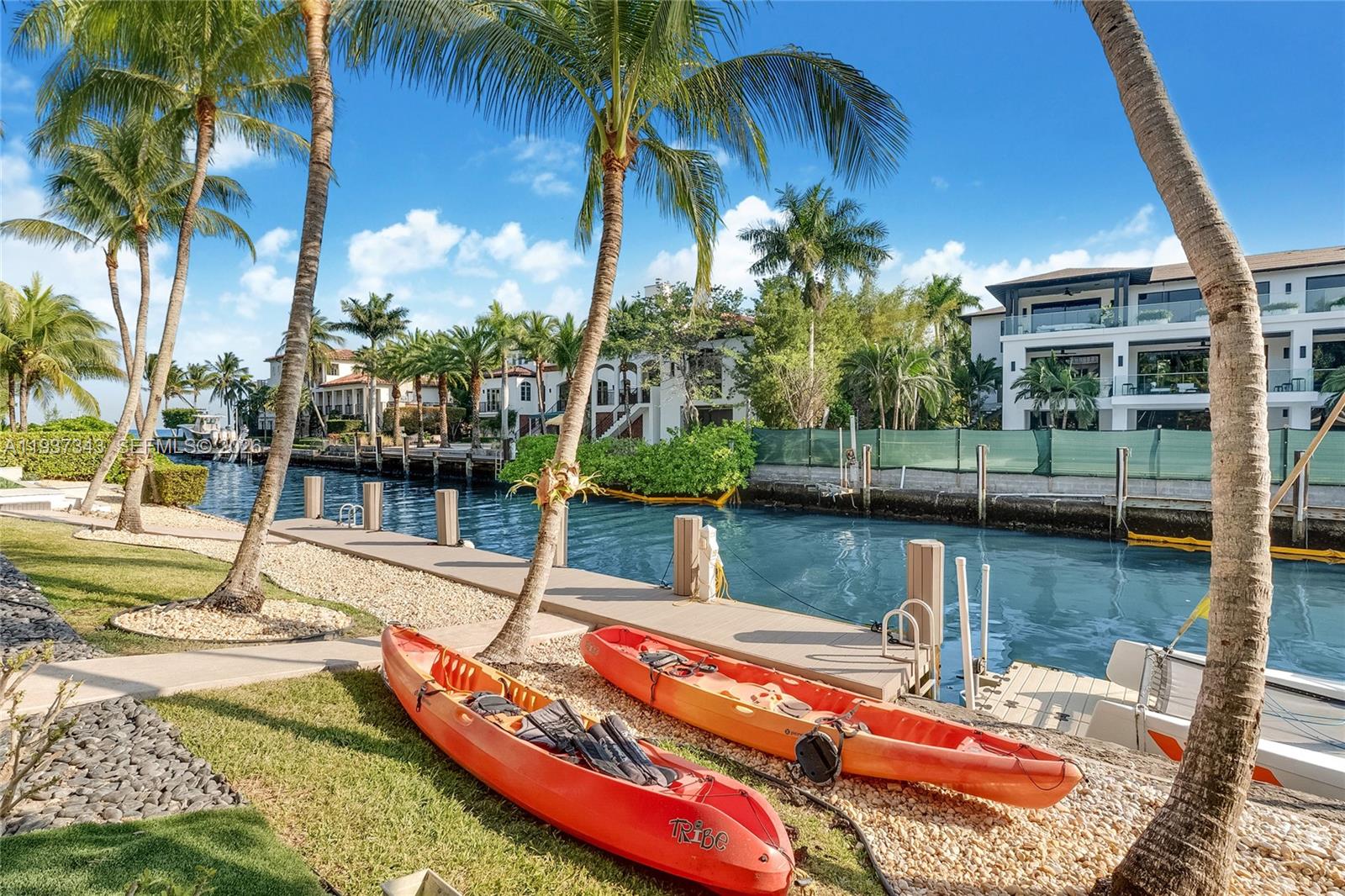 3835 Carole Court Miami, FL 33133 - Photo 19 of 41 a view of a swimming pool with a patio and a lake view