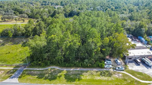 a view of a swimming pool with a yard