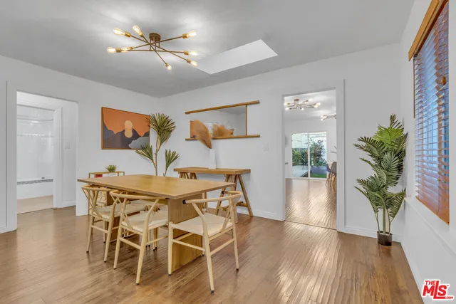a bathroom with a granite countertop sink mirror bathtub and shower