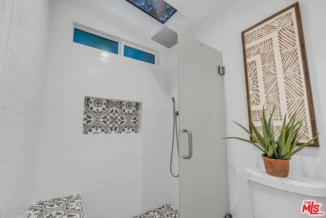 a bathroom with a bathtub and shower