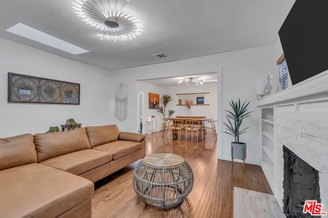 a kitchen with a refrigerator and a stove top oven