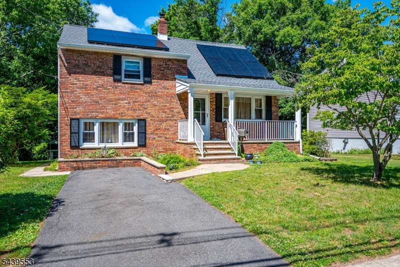 15 Woodmere Street Raritan, NJ 08869 - Photo 3 of 16 a front view of a house with a yard and garage