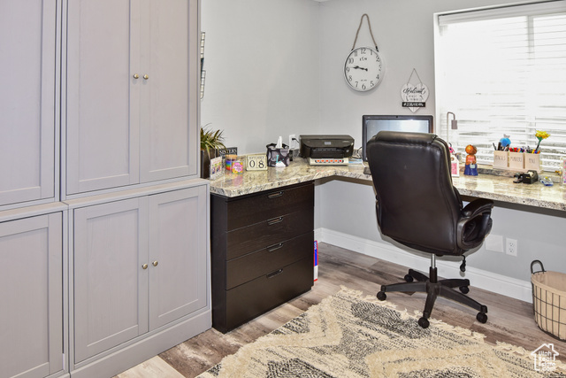 1500 Fish Creek Road Bancroft, ID 83217 - Photo 28 of 45 Home office with light wood finished floors and built in desk
