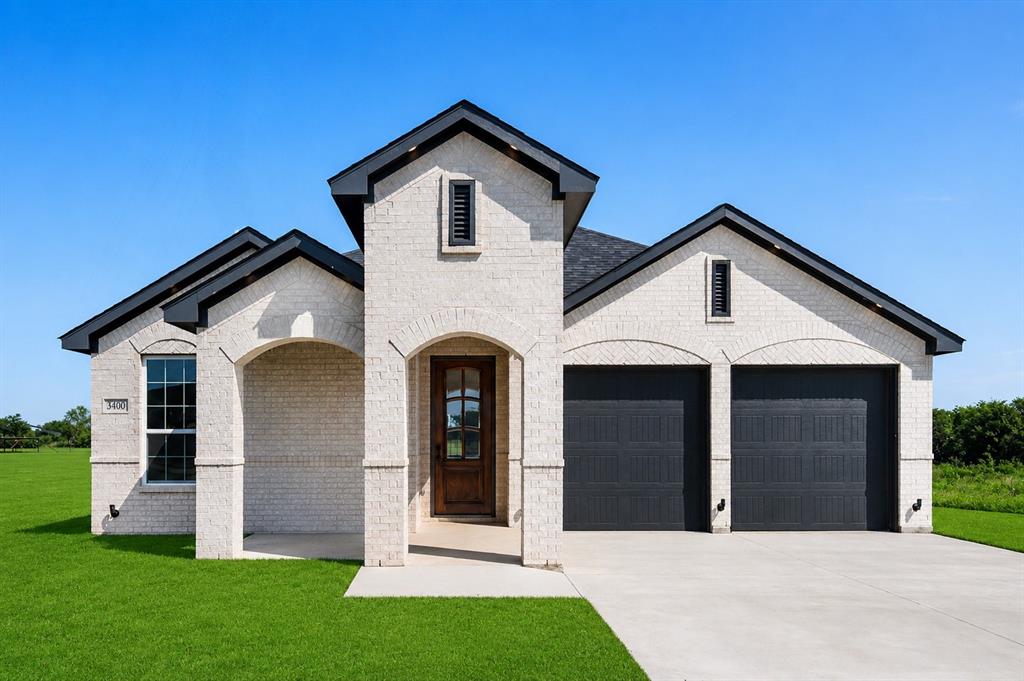3400 Dobbins Road Corsicana, TX 75110 - Photo 1 of 40 a front view of a house with a yard