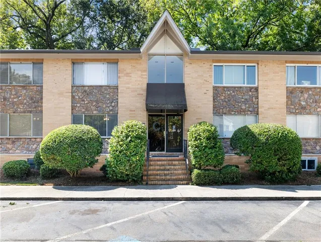a front view of a house with garage