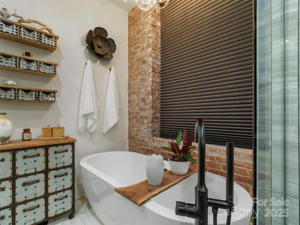 a bathroom with a tub and a sink