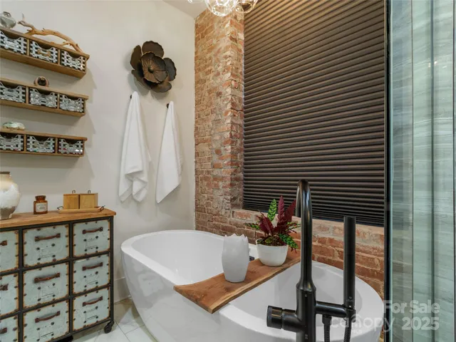 a bathroom with a tub and a sink