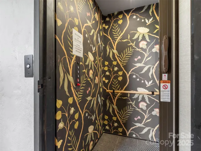 a bathroom with a door and a shower curtain