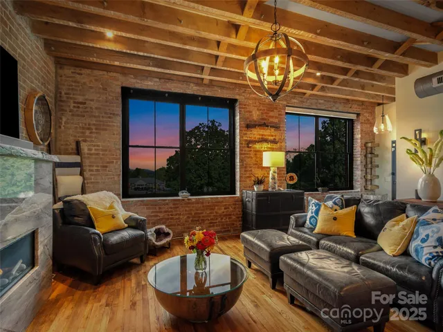 a outdoor living space with patio furniture and a fireplace