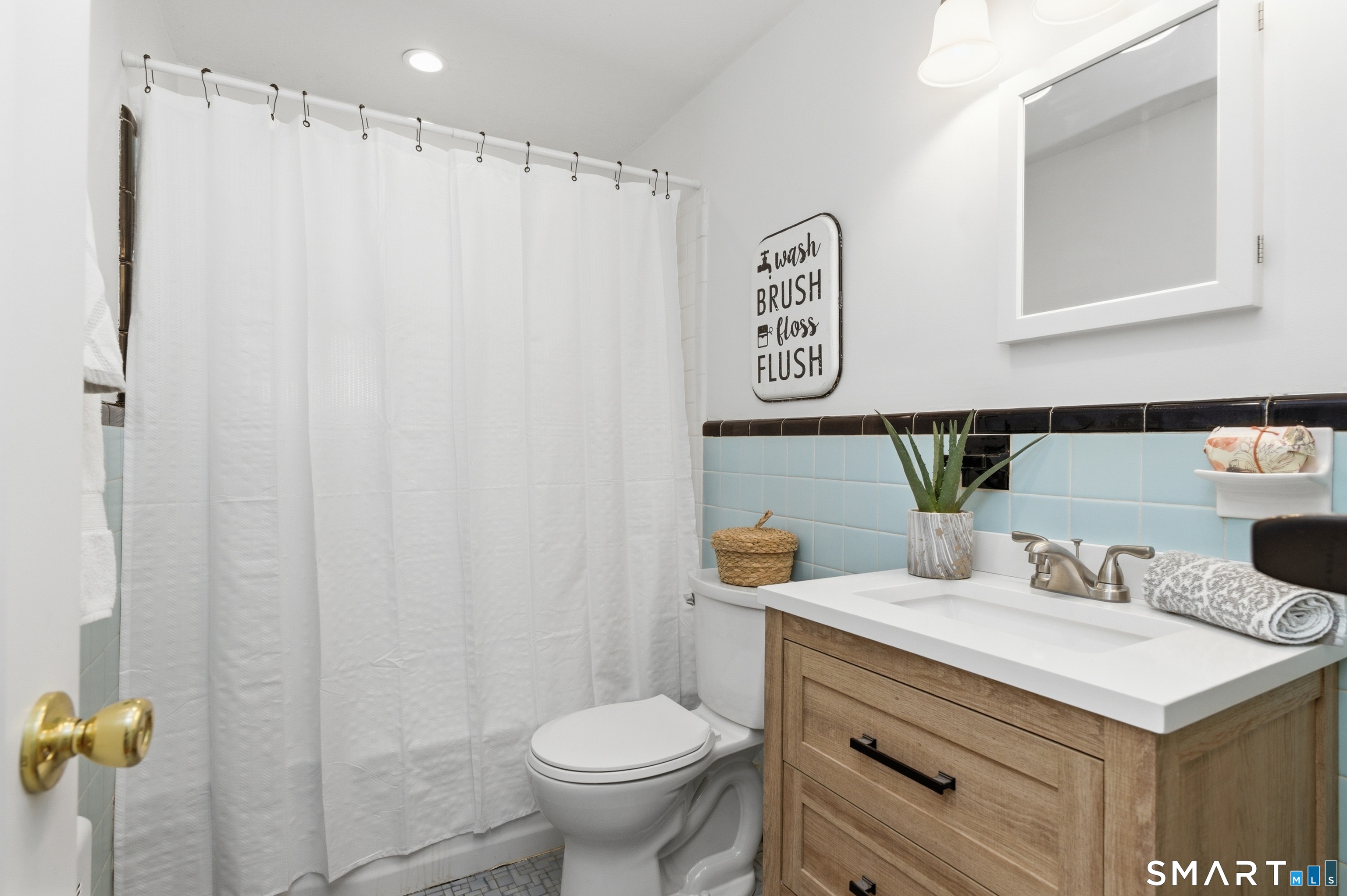 149 Mill Street Wethersfield, CT 06109 - Photo 16 of 29 a bathroom with a sink toilet and vanity