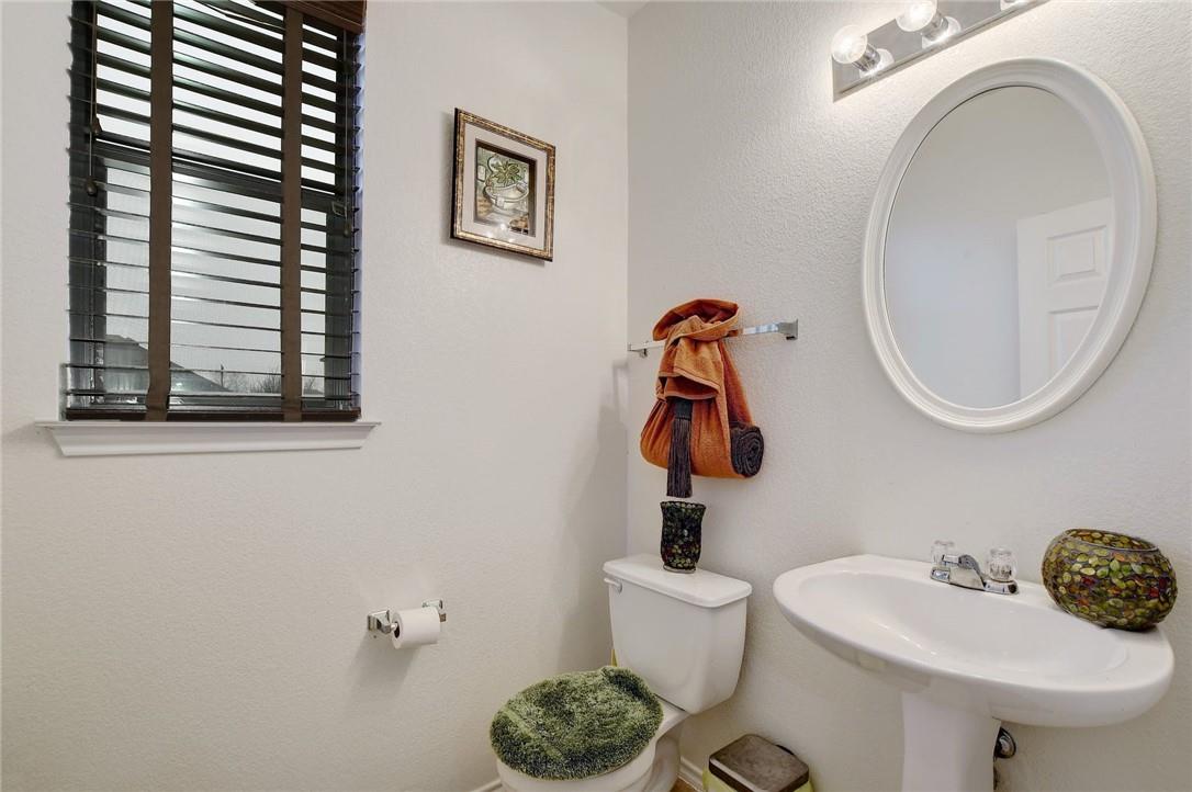 356 Matthews Kyle, TX 78640 - Photo 18 of 30 A well-lit powder room offers comfort and simplicity.
