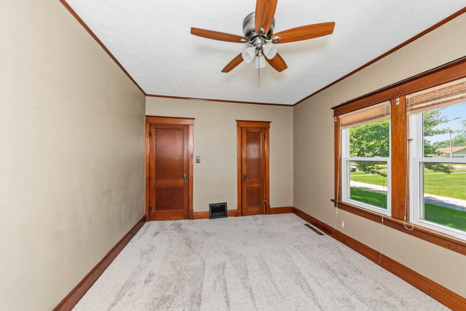 412 West 5th Street Minonk, IL 61760 - Photo 15 of 23 a view of a livingroom with a ceiling fan and window