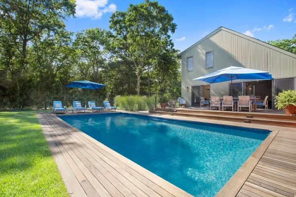 a view of a swimming pool with a patio