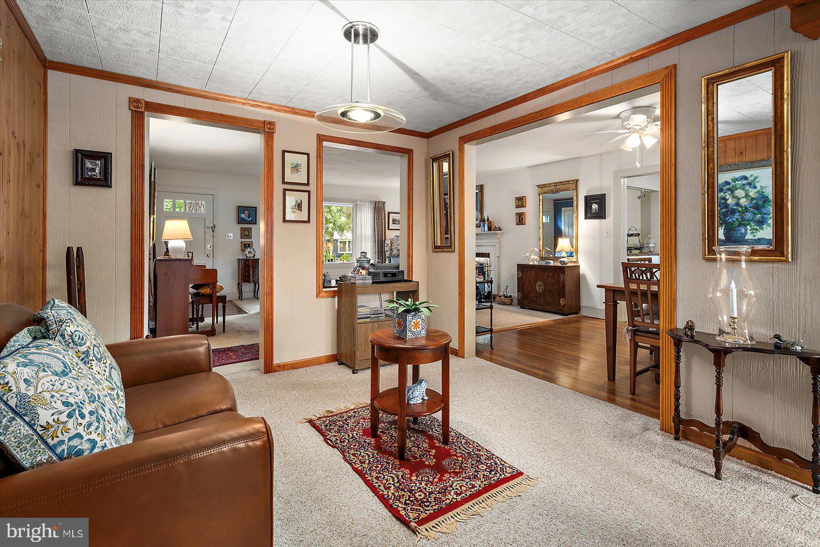 1001 Riverside Drive Salisbury, MD 21801 - Photo 12 of 47 a living room with furniture and a chandelier