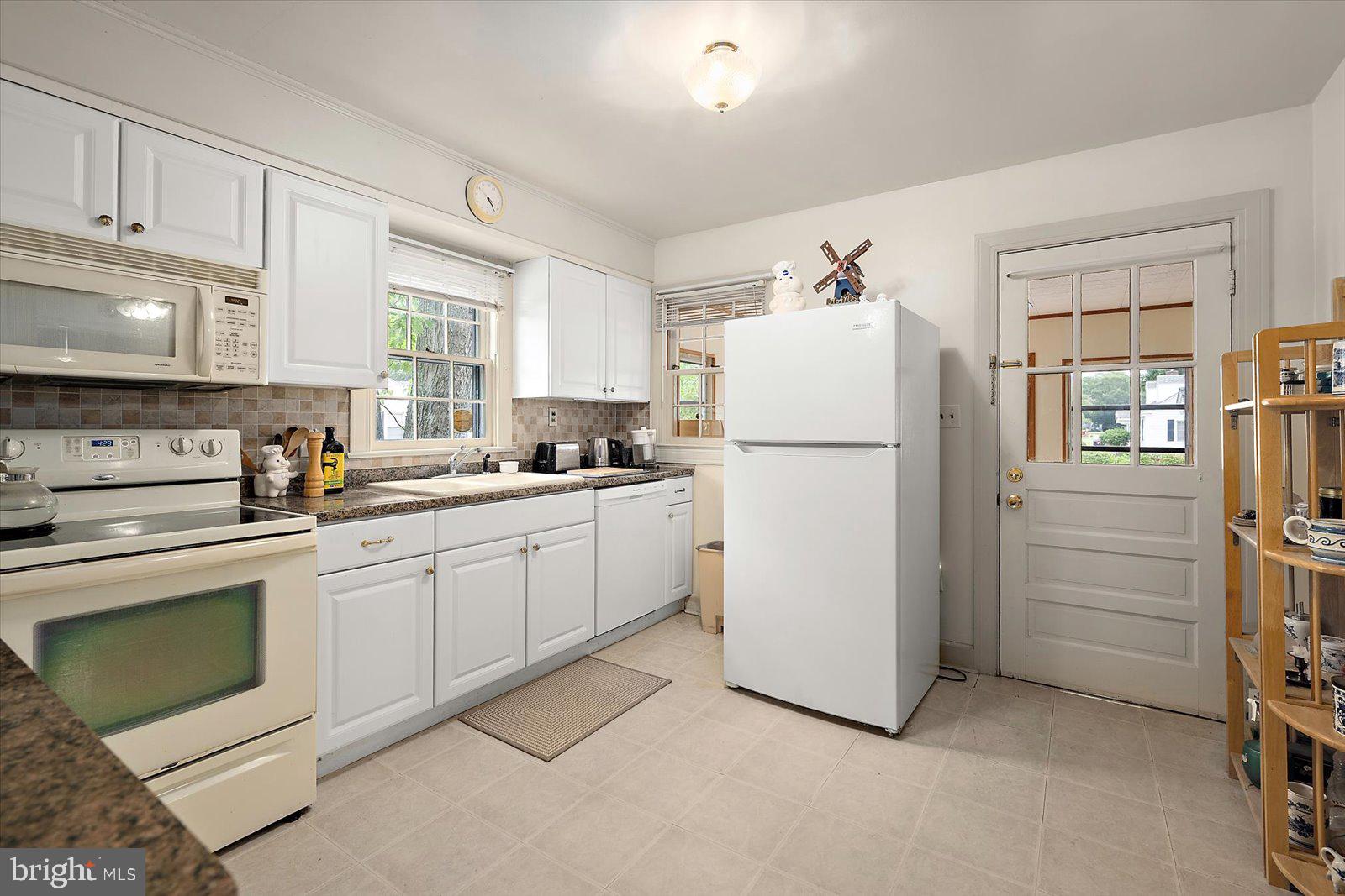 1001 Riverside Drive Salisbury, MD 21801 - Photo 20 of 47 a kitchen with a refrigerator sink stove and cabinets
